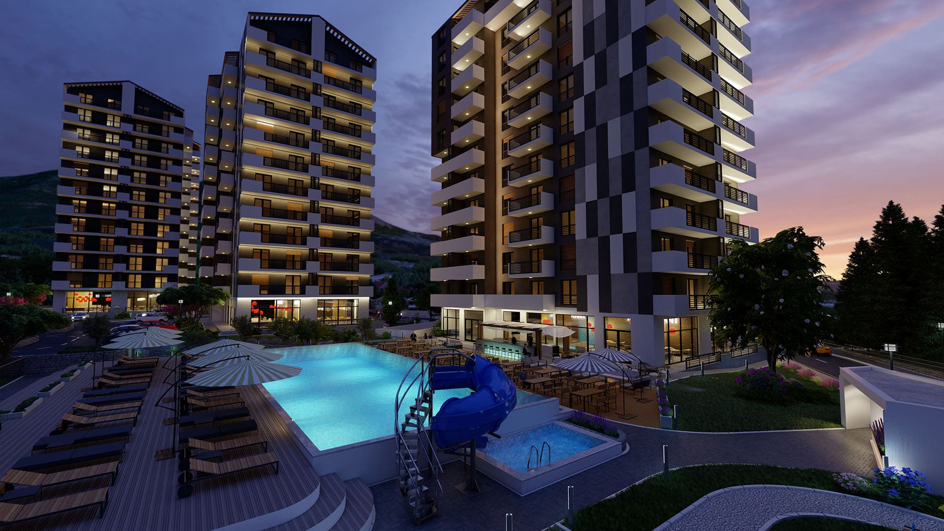Modern residential complex with a pool and slide in Bar, Montenegro: view of high-rise buildings in the evening.
