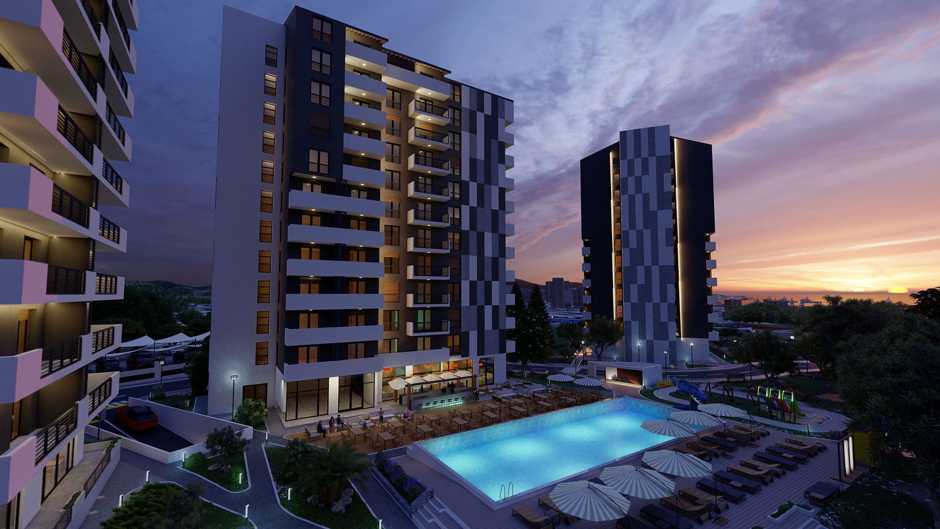 Modern residential complex with a pool and relaxation area in Bar, Montenegro, view of the buildings at sunset.