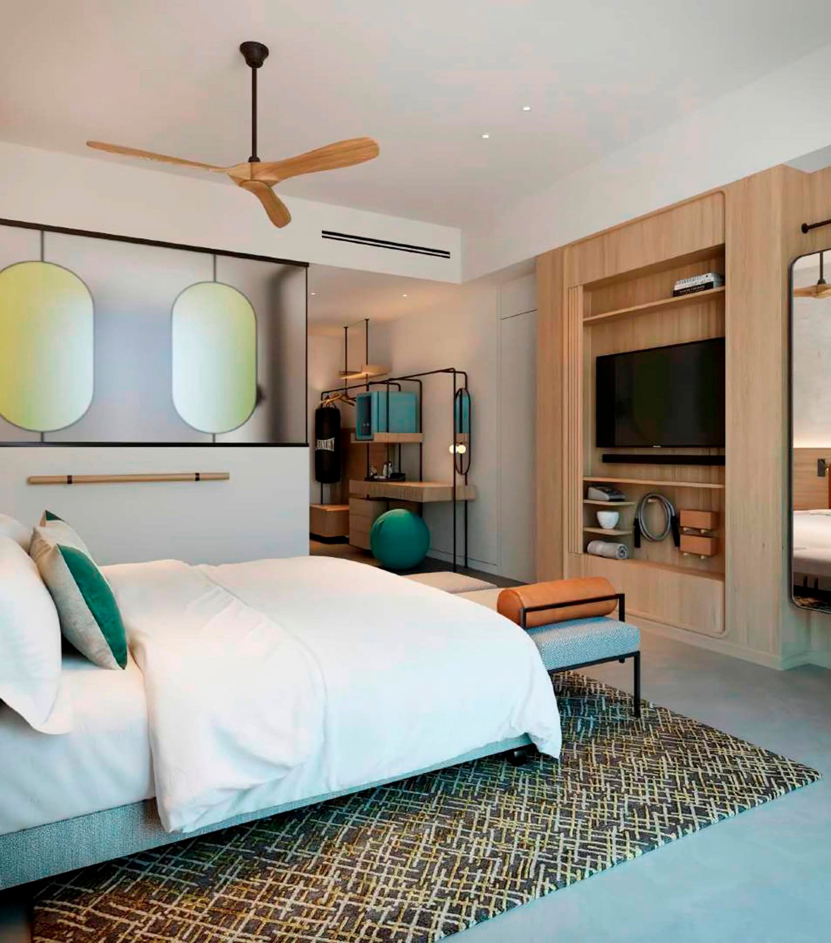 Modern bedroom at Boka Place Hotel, Tivat, Montenegro: stylish interior, fitness area, and wood finishes.