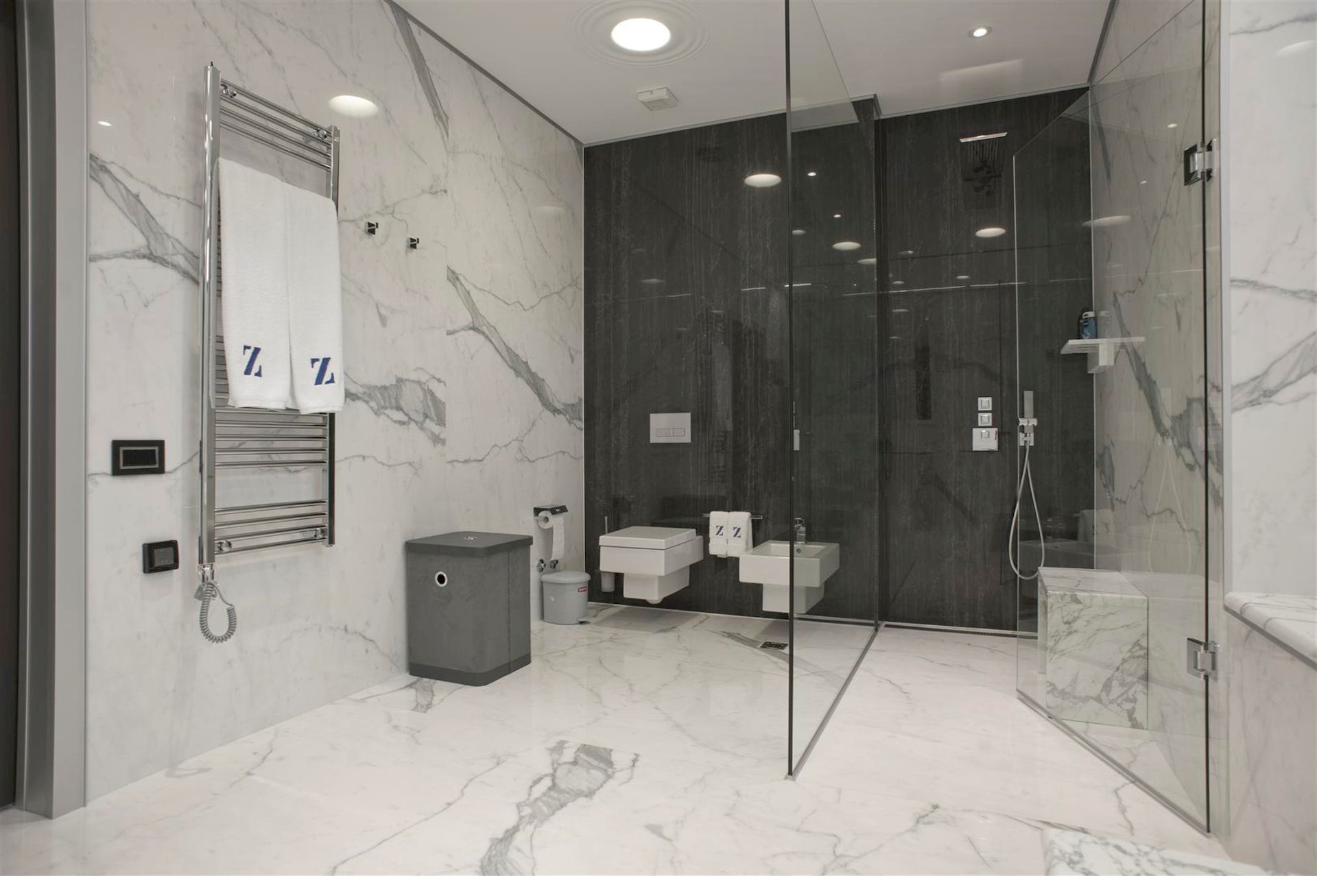 Modern bathroom with marble finishes and a shower cabin in a villa in Krašići, Montenegro.