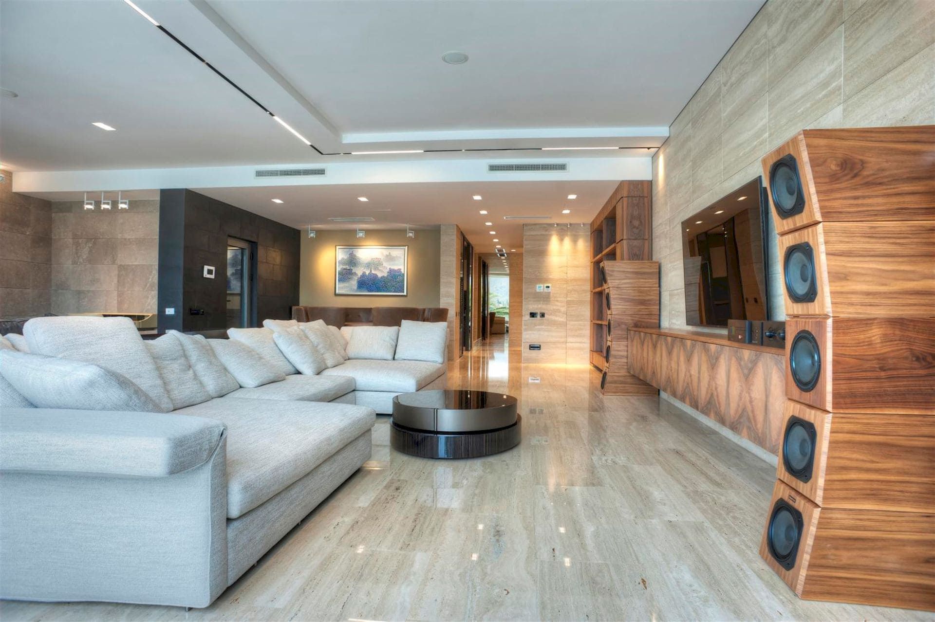 Modern living room with marble floor and audio system in a villa in Krašići, Montenegro. Designer interior.