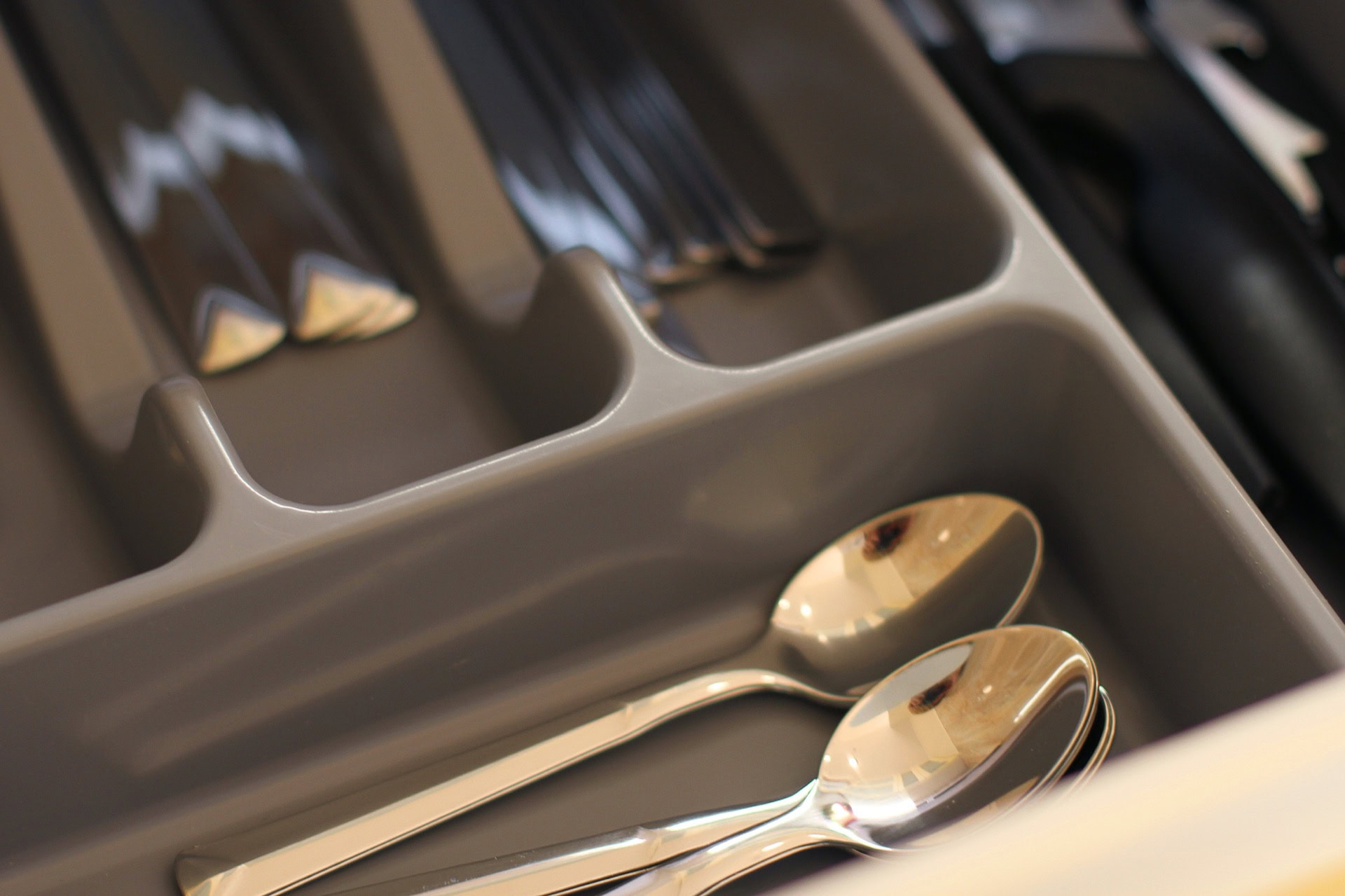 Cutlery organizer in the kitchen drawer of an apartment in Bečići, Montenegro, for comfortable living.