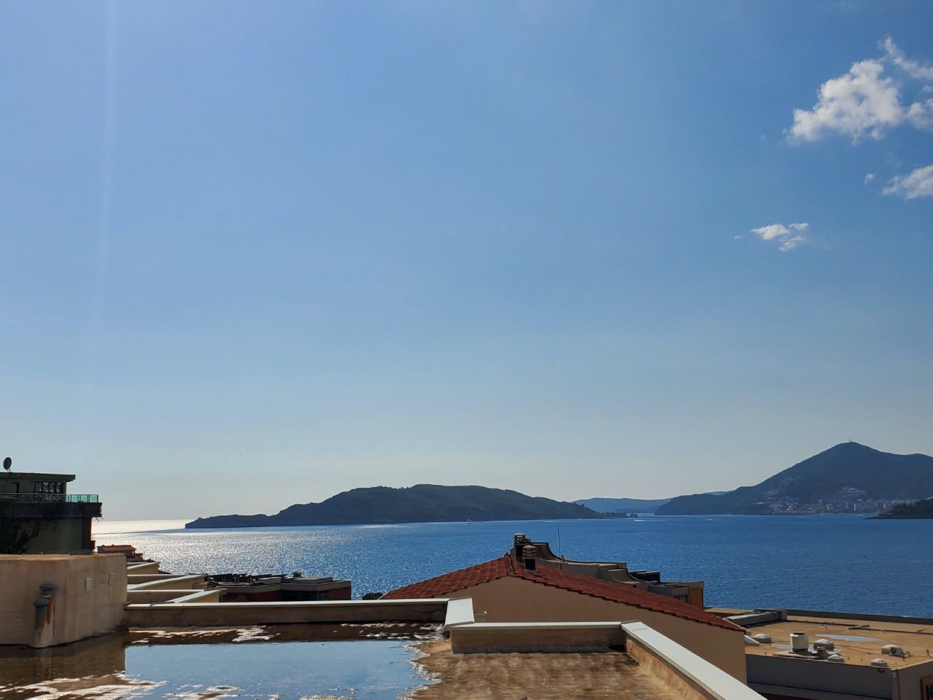 Panoramic view of the Adriatic Sea and the island from a penthouse in Pržno, Montenegro. View from the rooftop terrace.