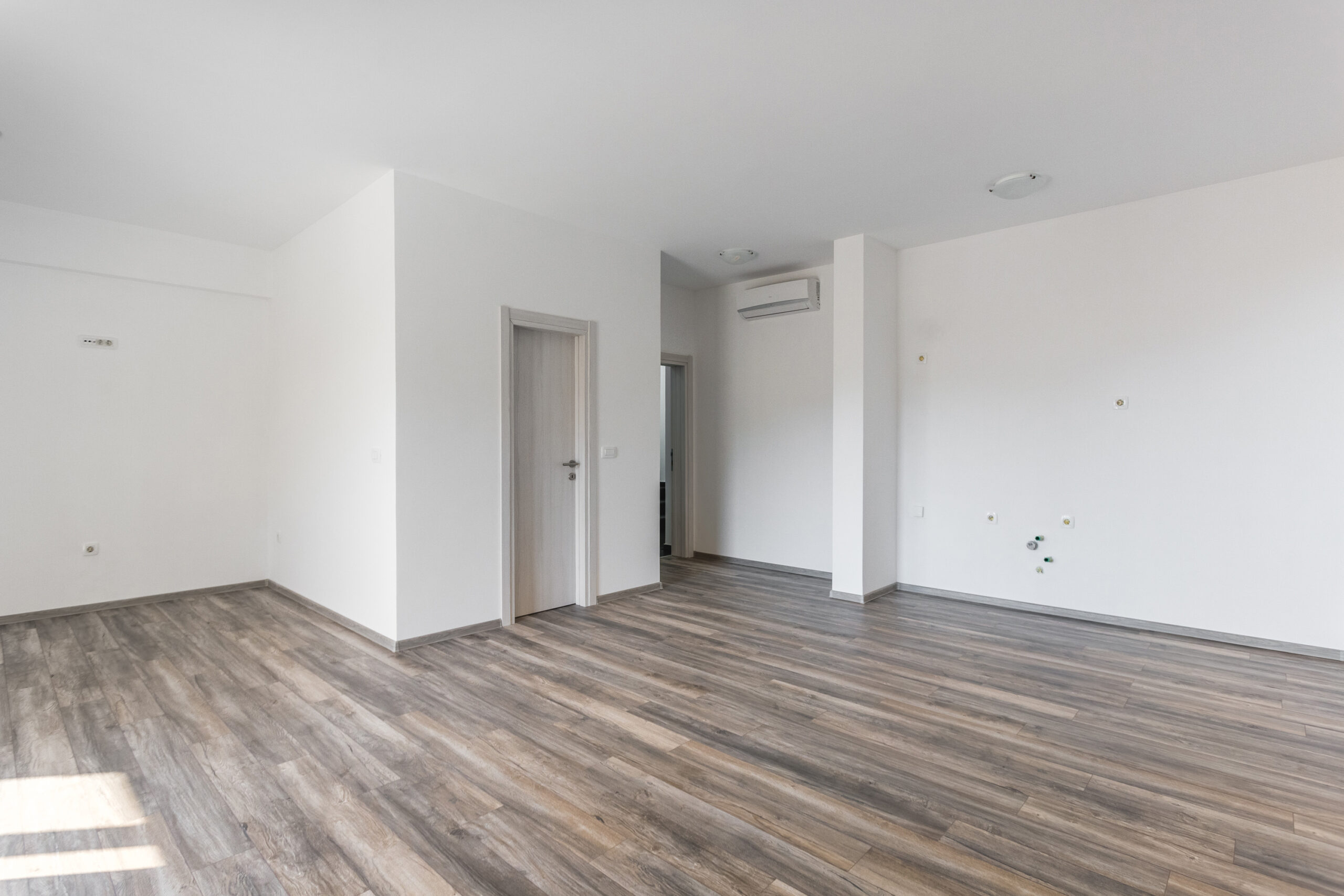 Bright living room with laminate flooring and air conditioning in a penthouse, Rafailovici, Budva Riviera, Montenegro.