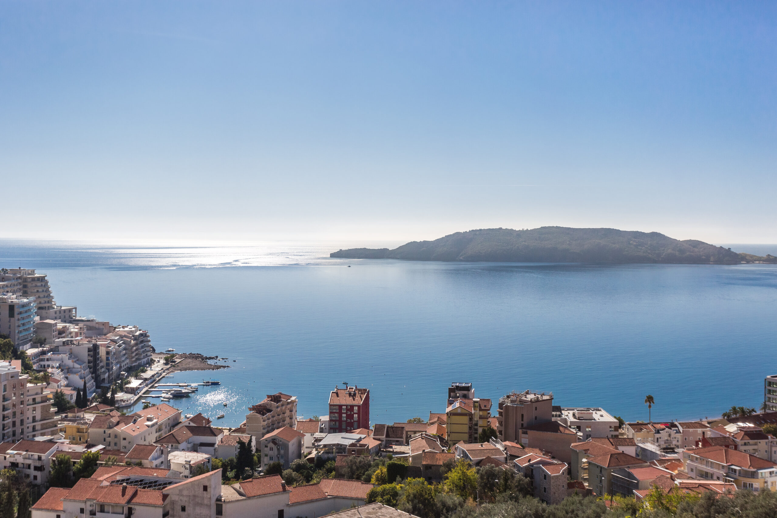 Panoramic view of the sea and St. Nicholas Island from a penthouse in Rafailovići, Budva Riviera, Montenegro.