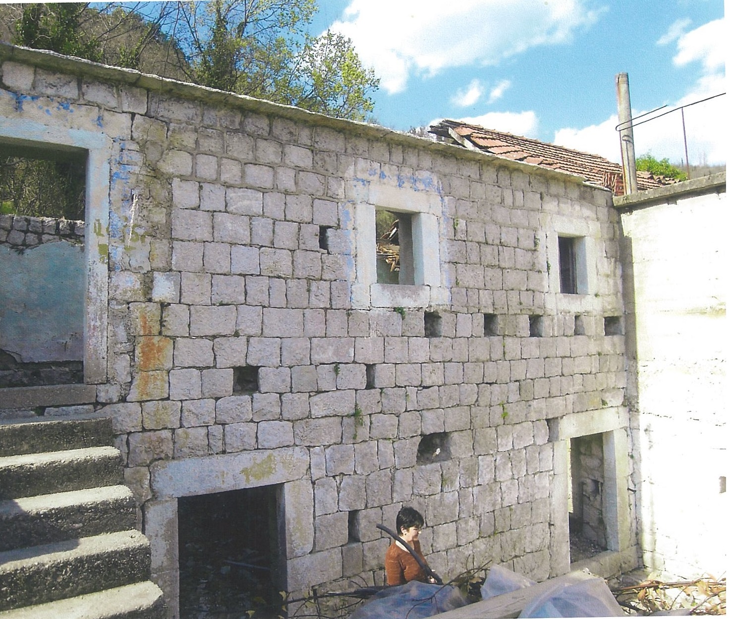 An old stone house for renovation on a plot in Lučići, Herceg Novi, Montenegro. Natural stone facade.