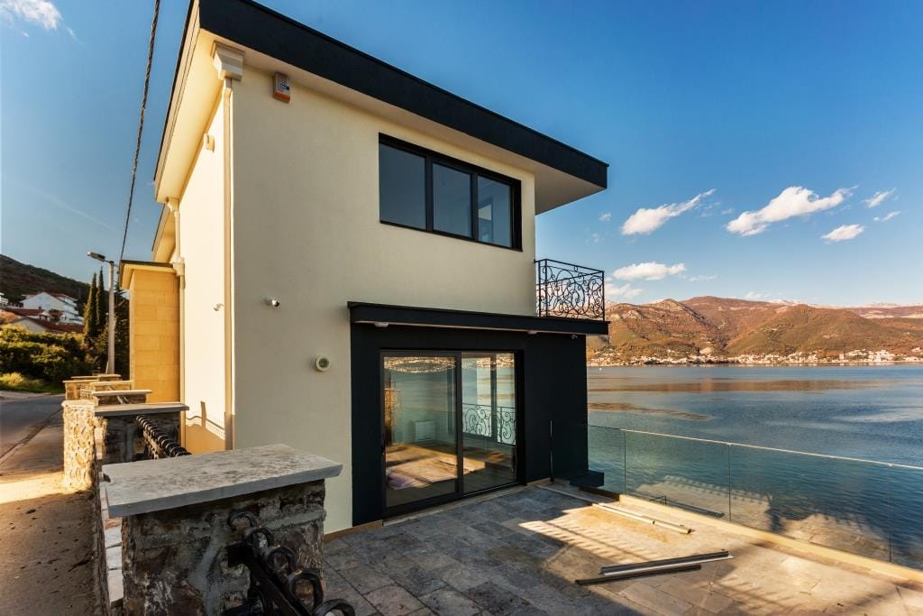 Modern villa with panoramic sea views in Krašići, Montenegro: terrace, balcony, and stylish house facade.
