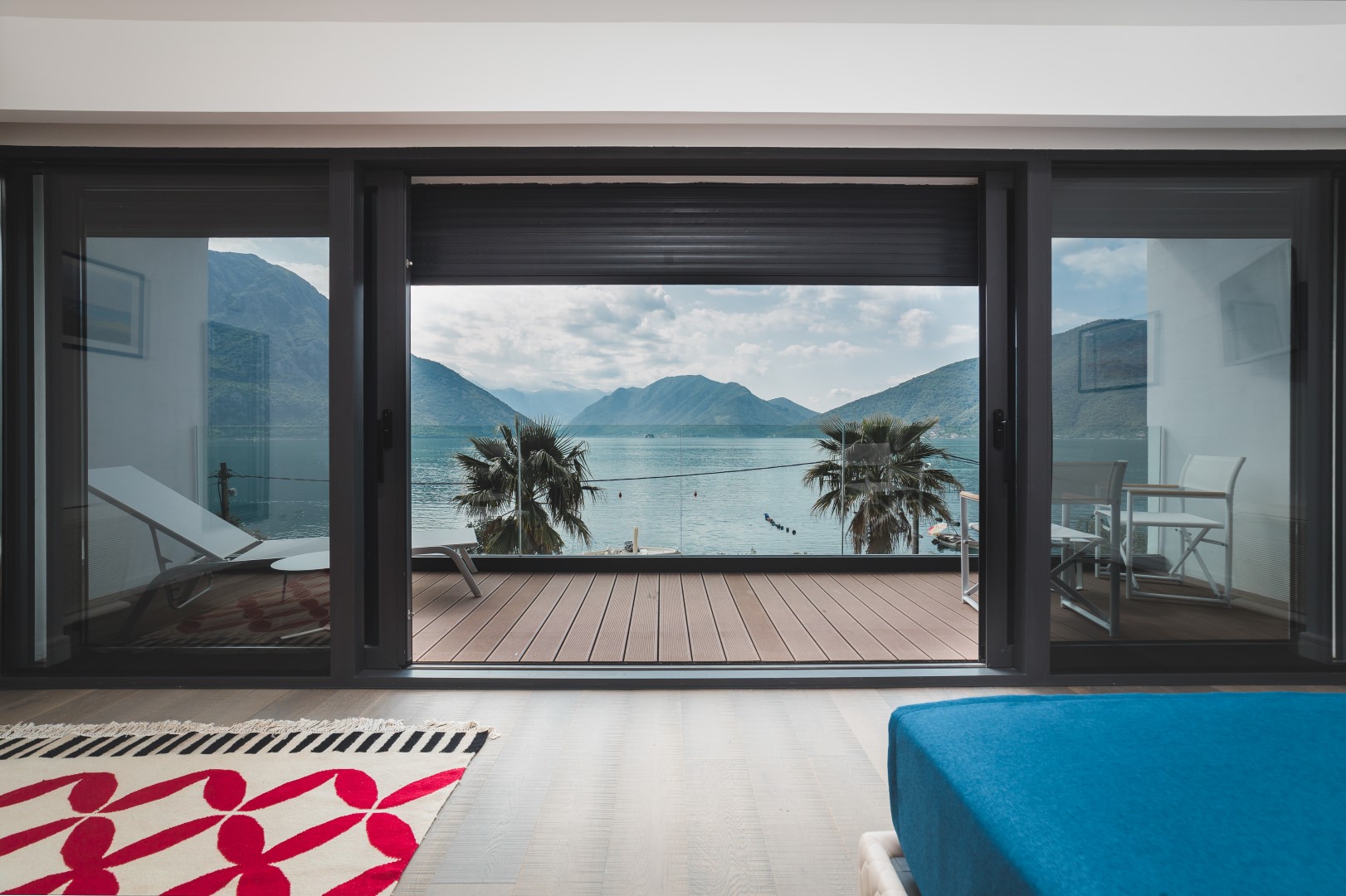 Bedroom in a villa in Strp, Montenegro, with panoramic views of Kotor Bay, a terrace, and modern finishes.