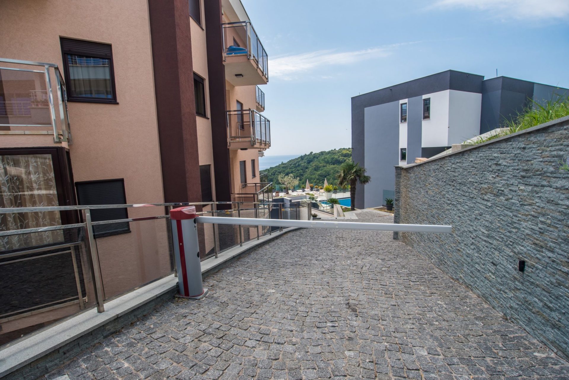 Gated entrance to the villa’s private grounds in Budva, Montenegro, with sea and pool views.