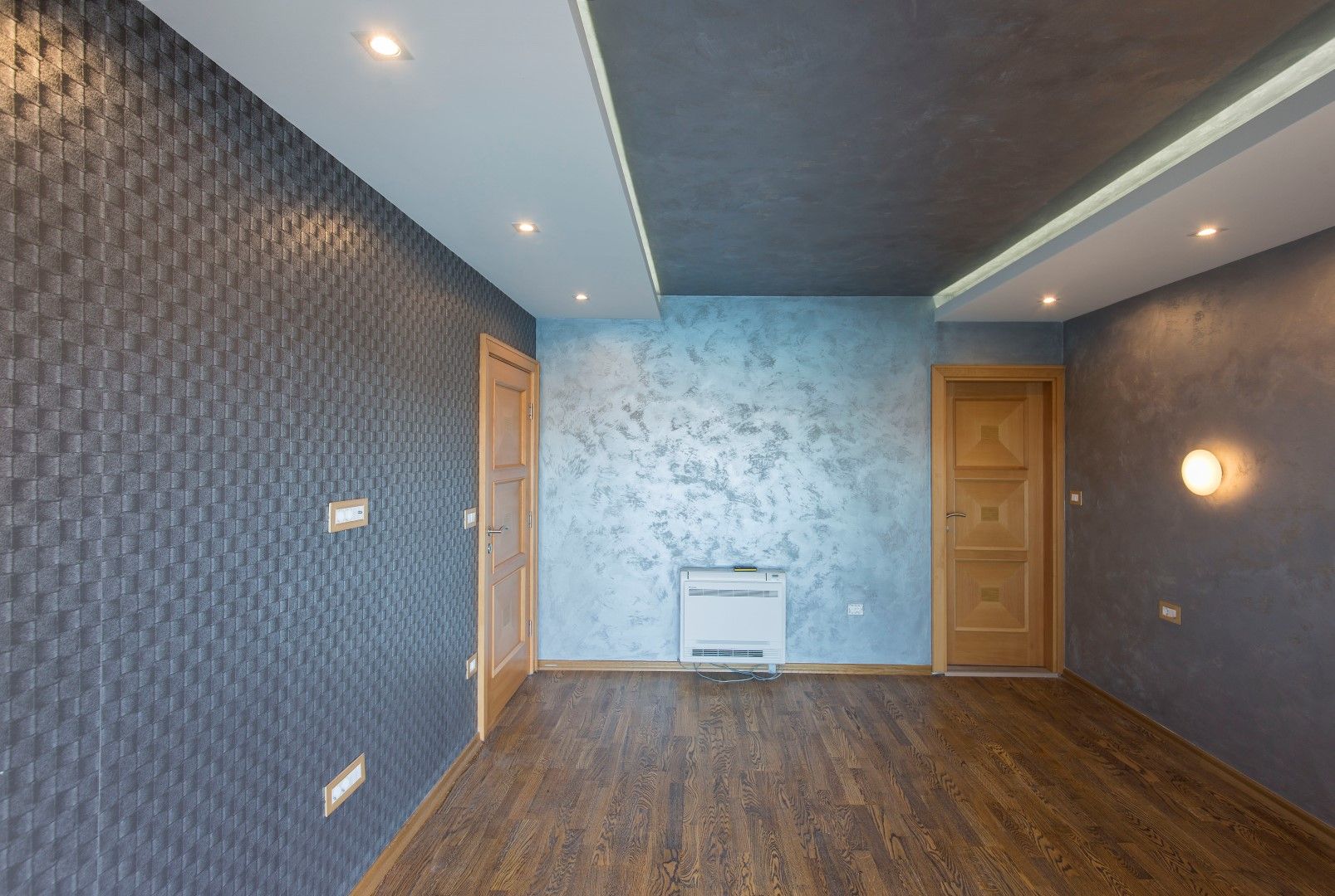 Living room with designer finishes and lighting in a villa in Krašići, Montenegro: parquet flooring, decorative plaster.
