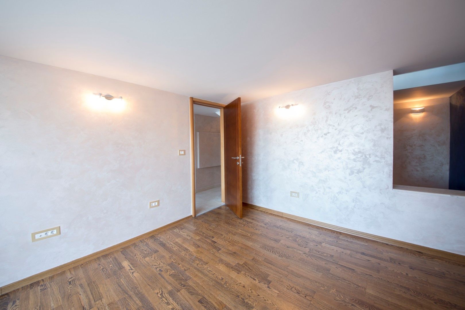 Bright living room with decorative plaster and parquet in a villa in Krašići, Montenegro.