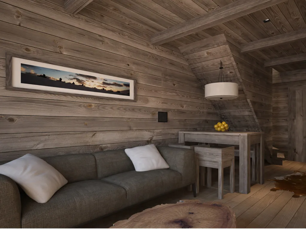 Wood-paneled room featuring a grey sofa, wooden dining table, pendant light, and panoramic wall art.