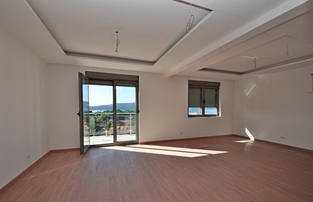 Bright living room with panoramic sea views in a new residential complex in Tivat, Montenegro, turnkey finish.