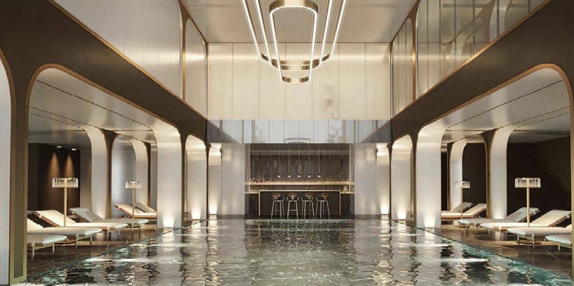 Indoor pool with sun loungers and a bar counter at the Breza hotel, Kolašin, Montenegro: modern interior design.