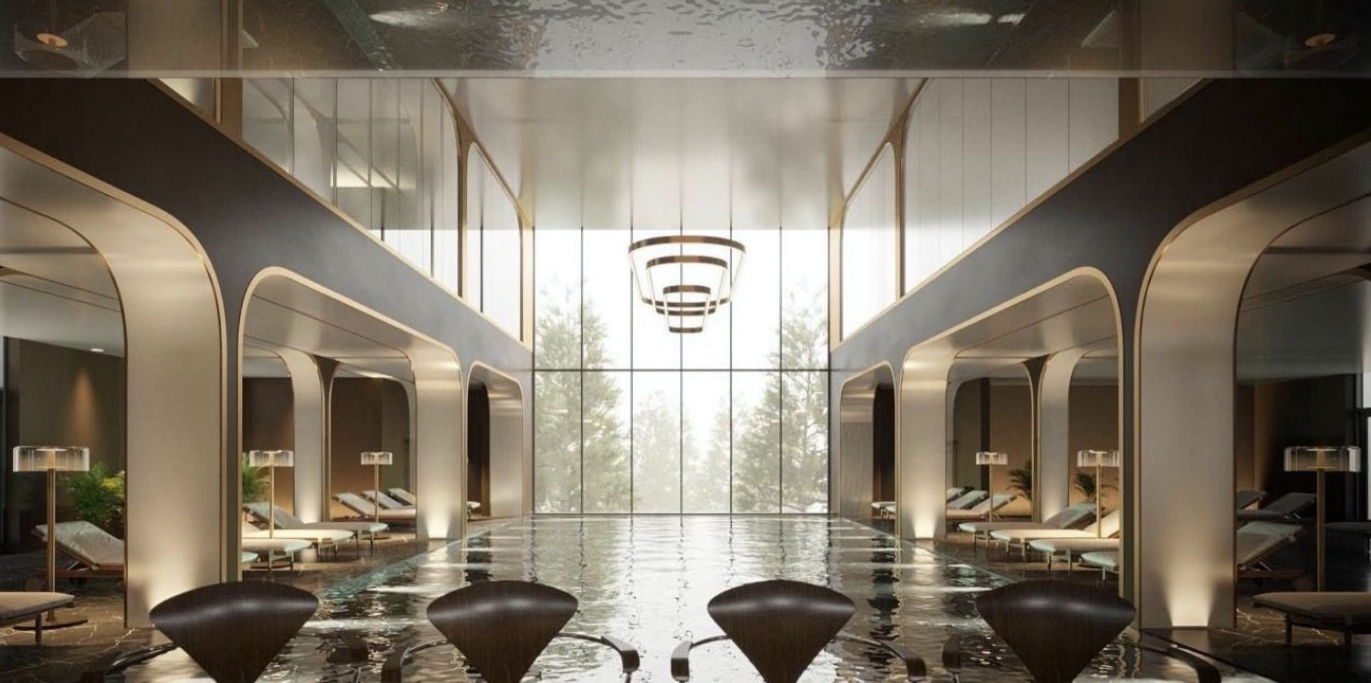 Indoor pool at the Breza Hotel, Kolašin, Montenegro: modern interior, panoramic windows, and a relaxation area with loungers.