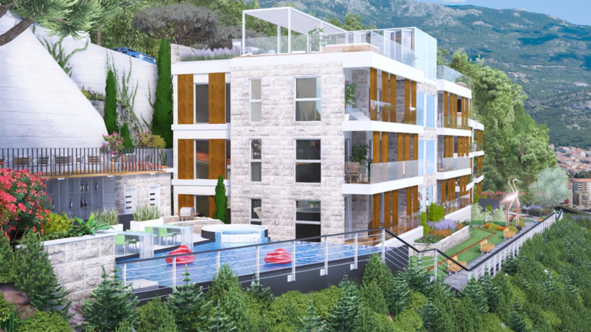 Modern residential complex in Budva, Montenegro: stone facade, outdoor pool, terraces, and mountain views.