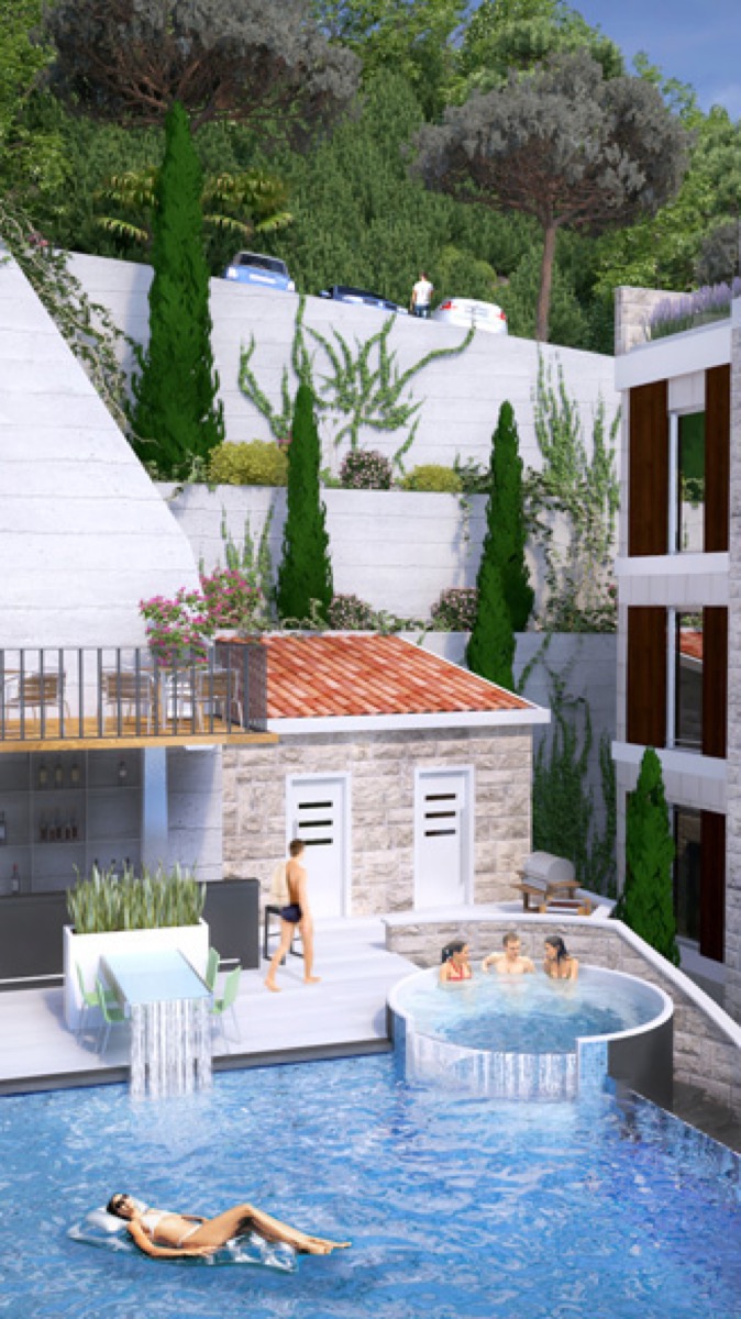 Pool with jacuzzi and relaxation area in a residential complex in Budva, Montenegro: modern finishes and landscaping.