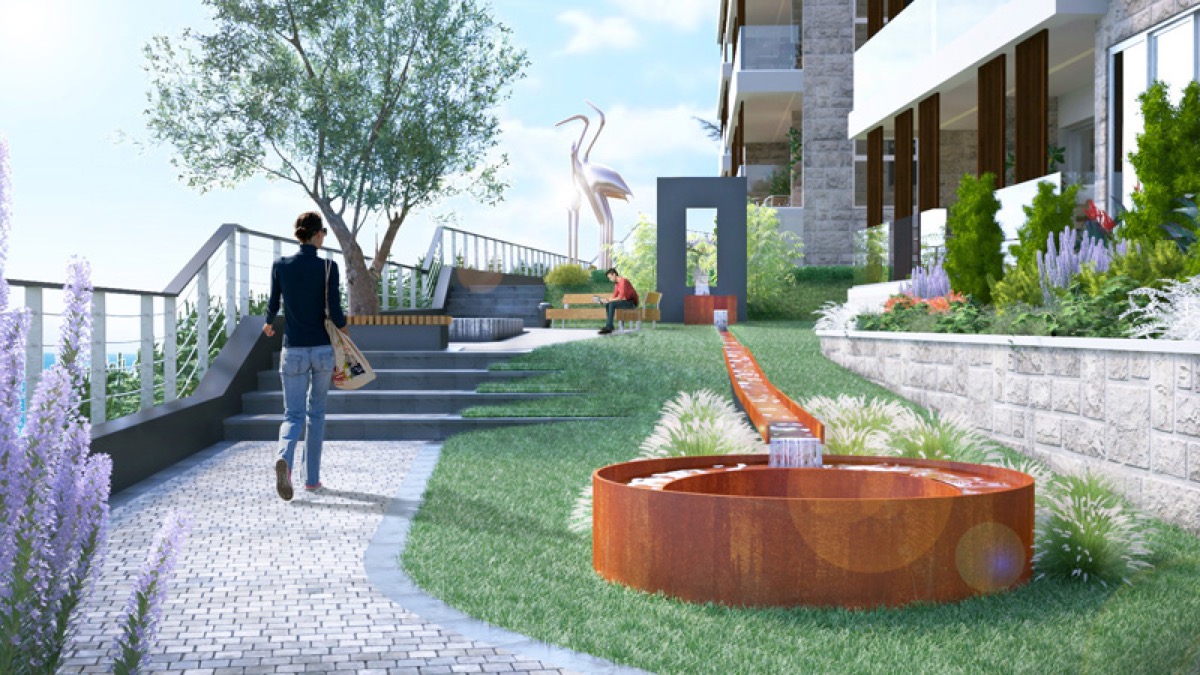 Landscaped grounds of a residential complex in Budva, Montenegro: landscape design, a fountain, and walking paths.