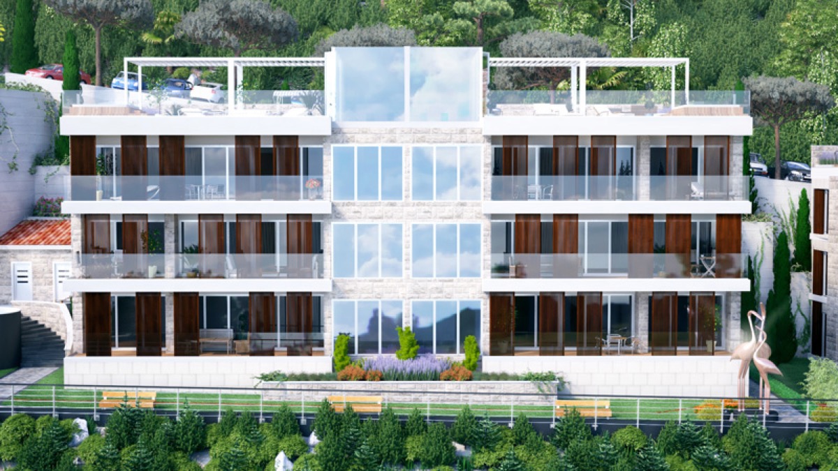 Modern residential complex in Budva, Montenegro: facade with panoramic windows, terraces, and landscape design.