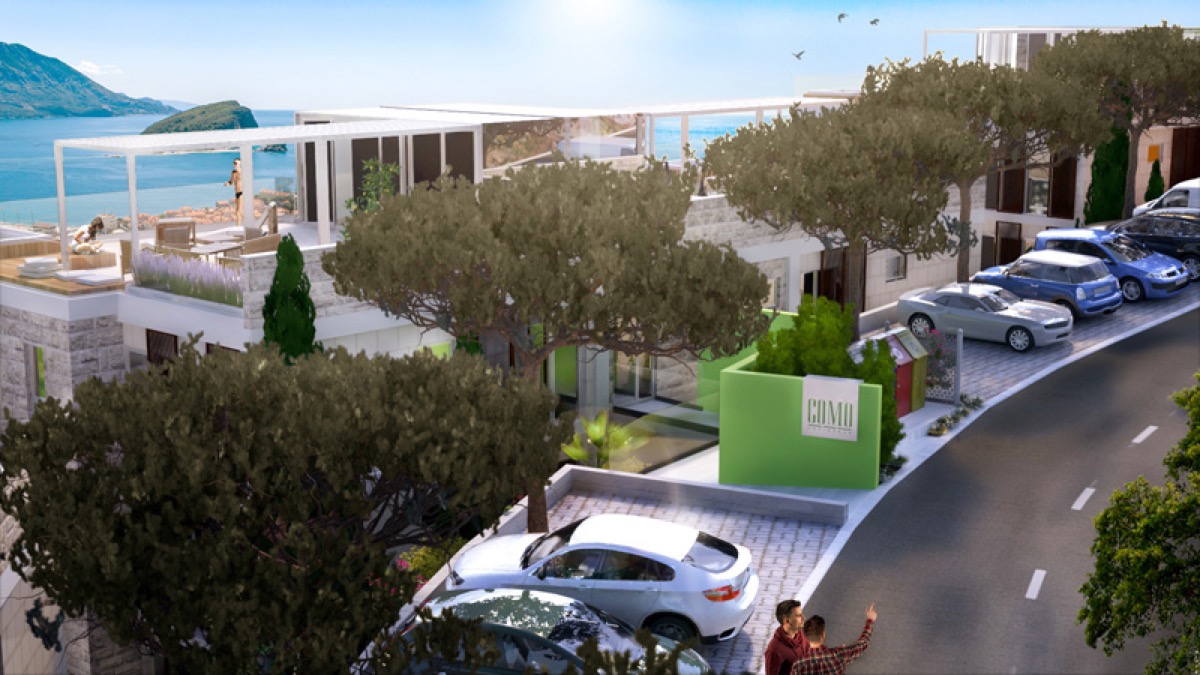 Residential complex in Budva, Montenegro: modern architecture, terrace with sea view, parking, and landscaping.