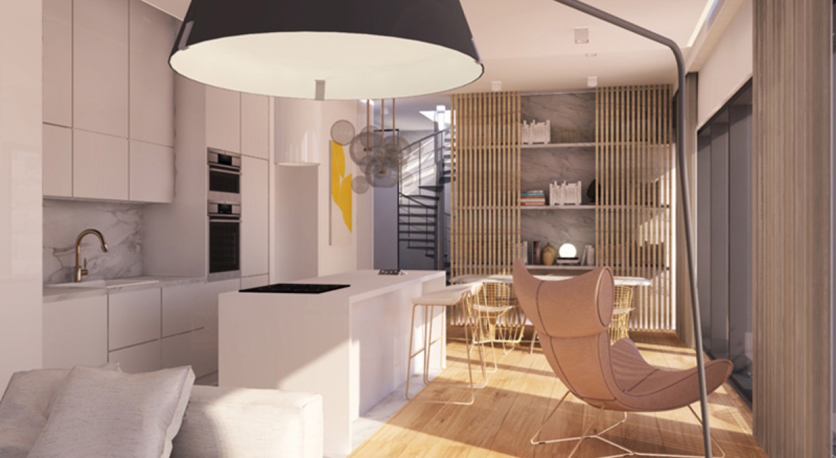 Modern kitchen-living room with an island and a spiral staircase in a residential complex in Budva, Montenegro. Designer interior.