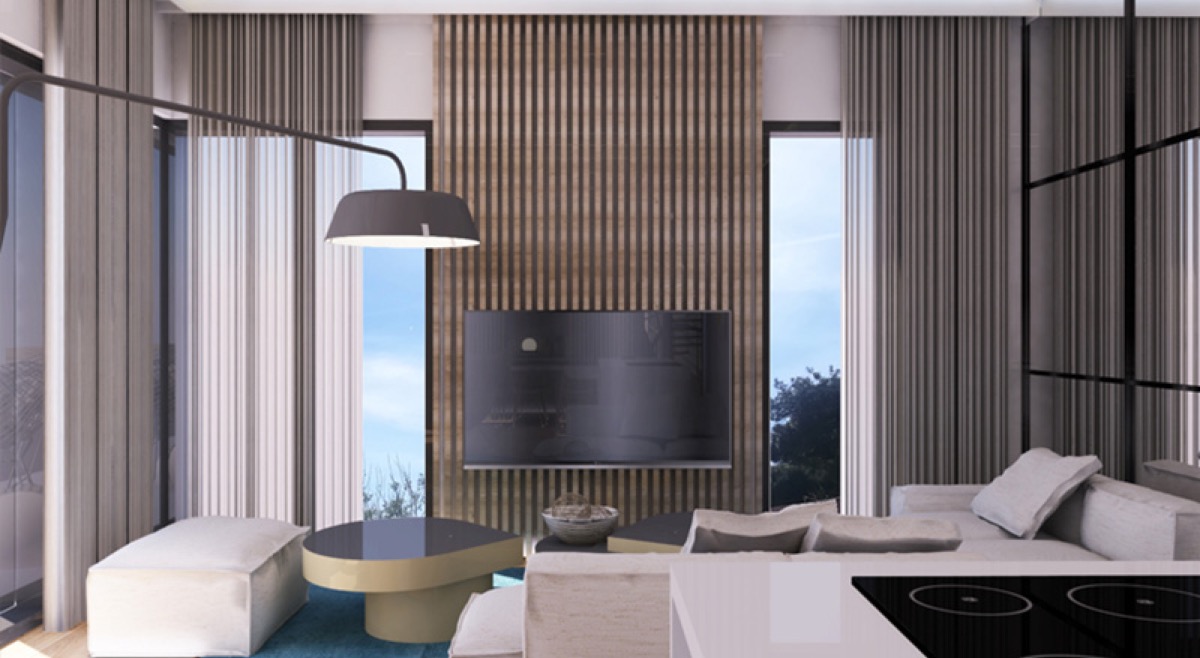 Modern living room in Budva residential complex, Montenegro: wooden slats, panoramic windows, stylish furniture, and TV area.