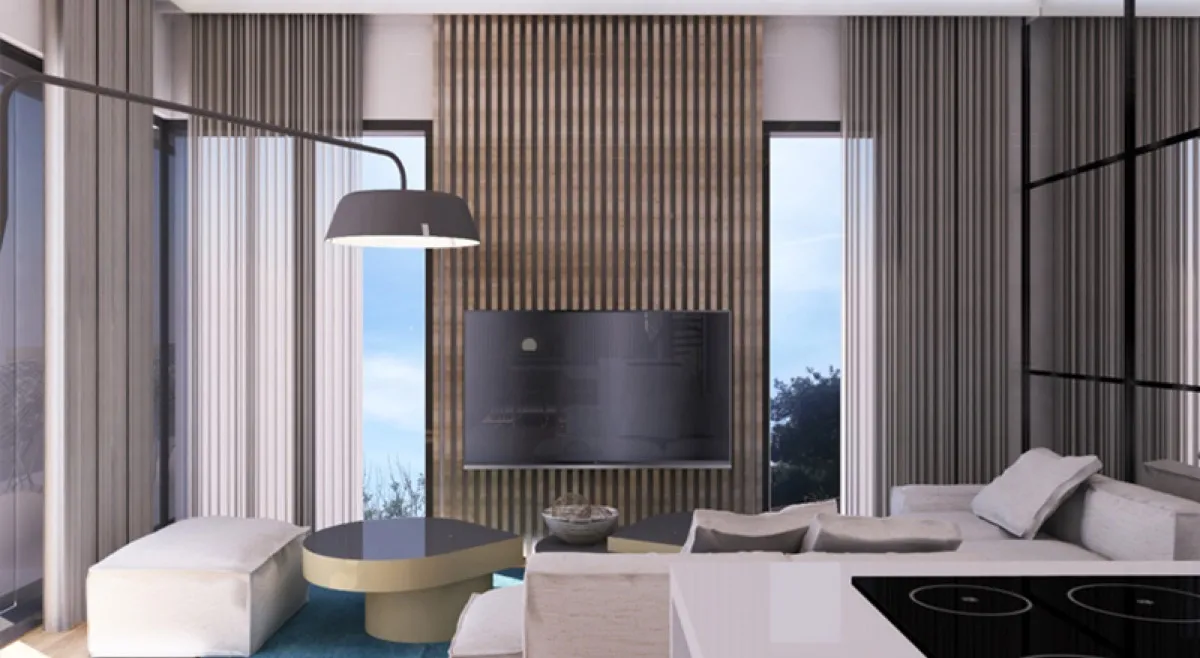Modern living room with sofa, TV on wood panel, large window, and floor lamp.