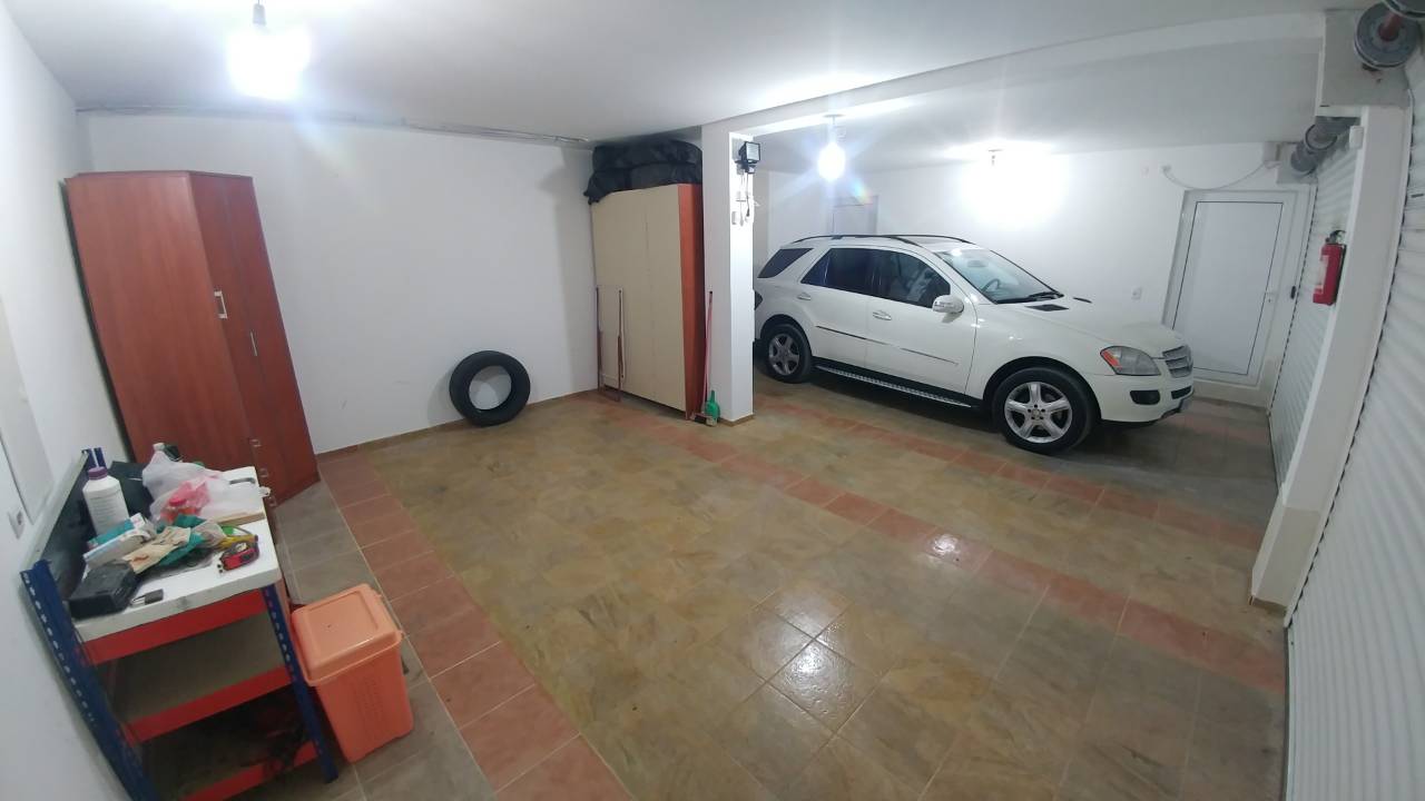 Spacious garage with tile flooring and storage space in a house in Ratac, Bar Riviera, Montenegro.
