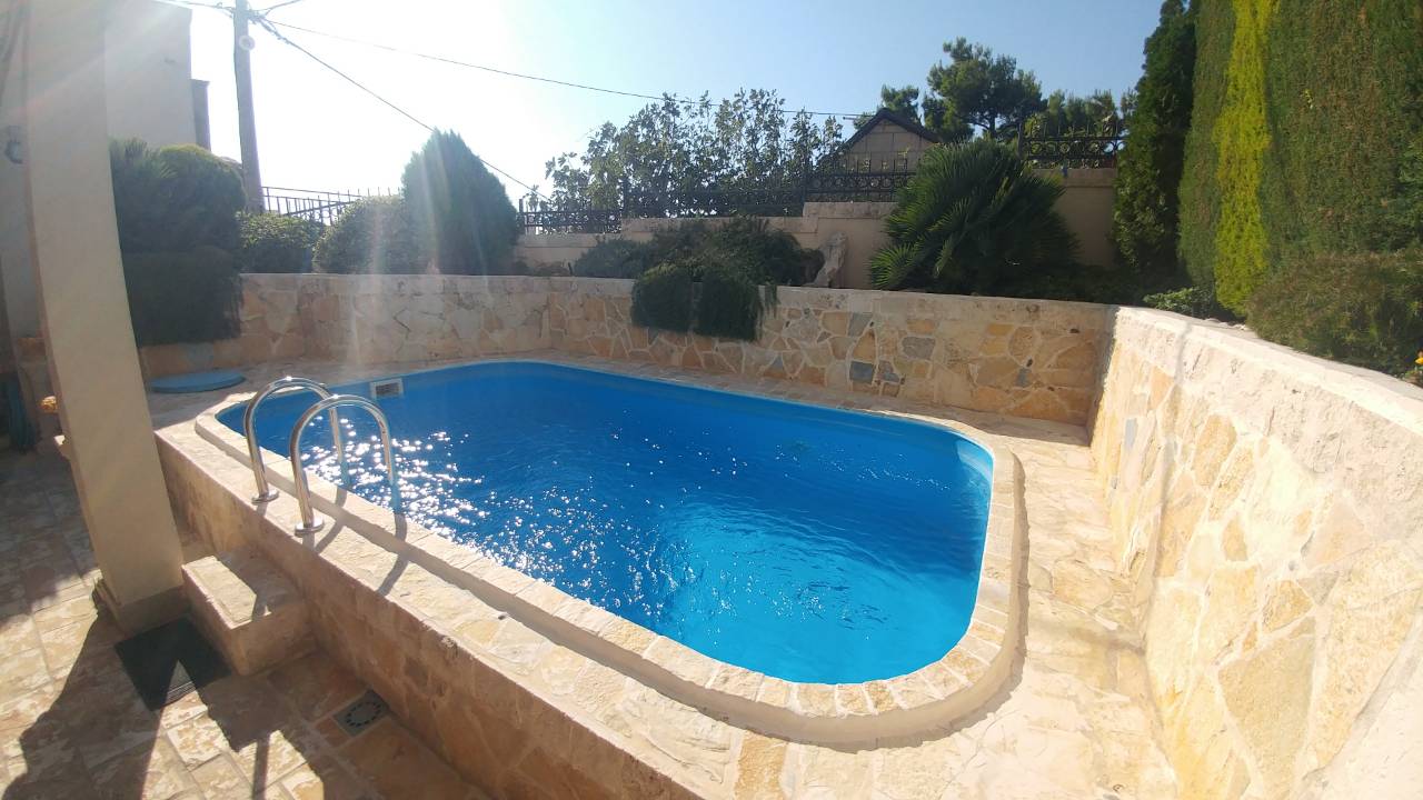 Private pool with stone finish on the house terrace in Ratac, Bar Riviera, Montenegro.