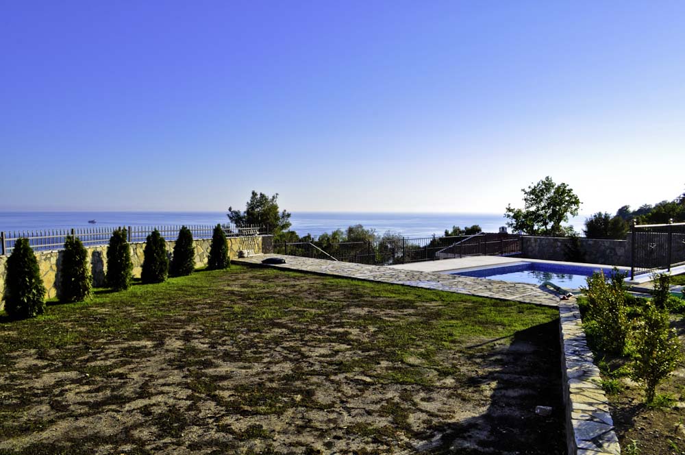 Villa in Shushan, Montenegro: private pool, stone-finished terrace, and panoramic view of the Adriatic Sea.