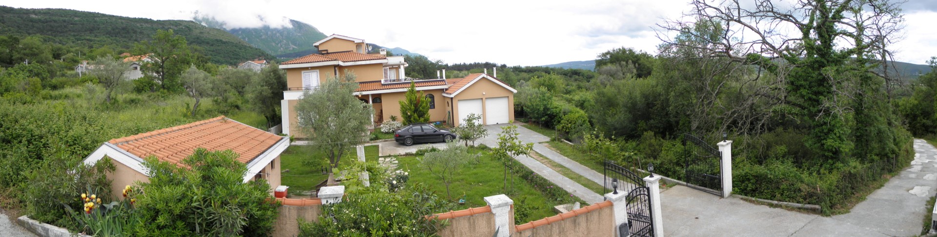 Two-story villa with garage and garden in Kavac, Bay of Kotor, Montenegro: view of the plot and mountains.
