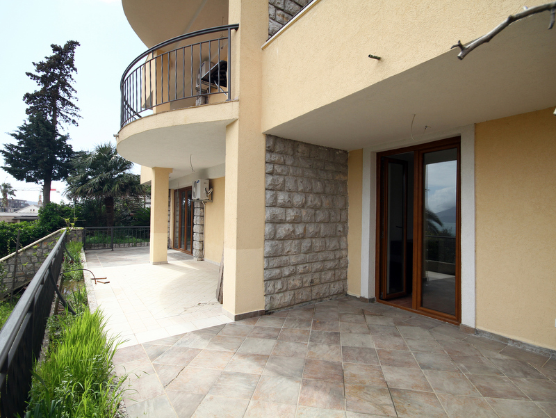 Spacious terrace with stone finishes and panoramic views in an apartment in Bečići, Montenegro.
