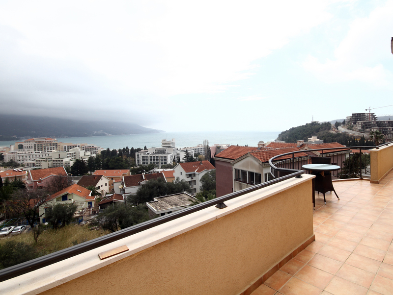 Spacious terrace with furniture and panoramic views of the sea and the city of Bečići, Montenegro. Apartment No. 1268.
