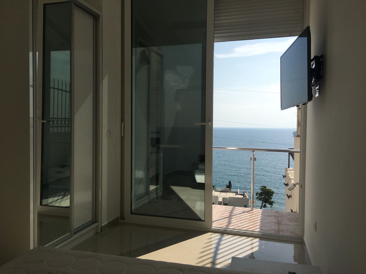 Bedroom with panoramic sea view and access to the balcony in a house, Šušanj, Bar Riviera, Montenegro.