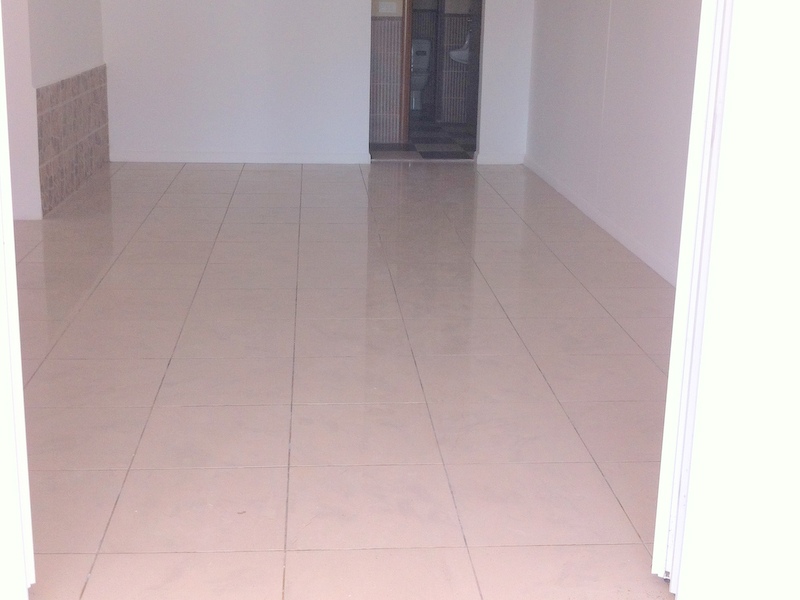 Bright living room with tiled floor and bathroom in an apartment for sale, Herceg Novi, Montenegro.