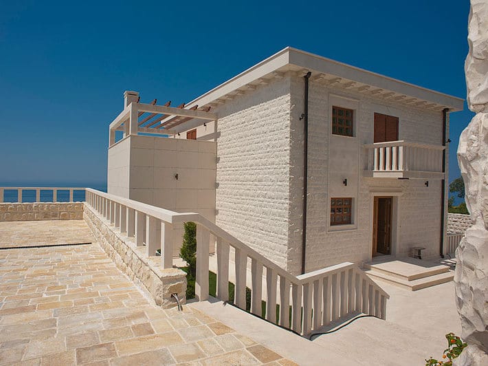 Two-story stone villa in Reževići, Montenegro, with a spacious terrace and panoramic views of the Adriatic Sea.
