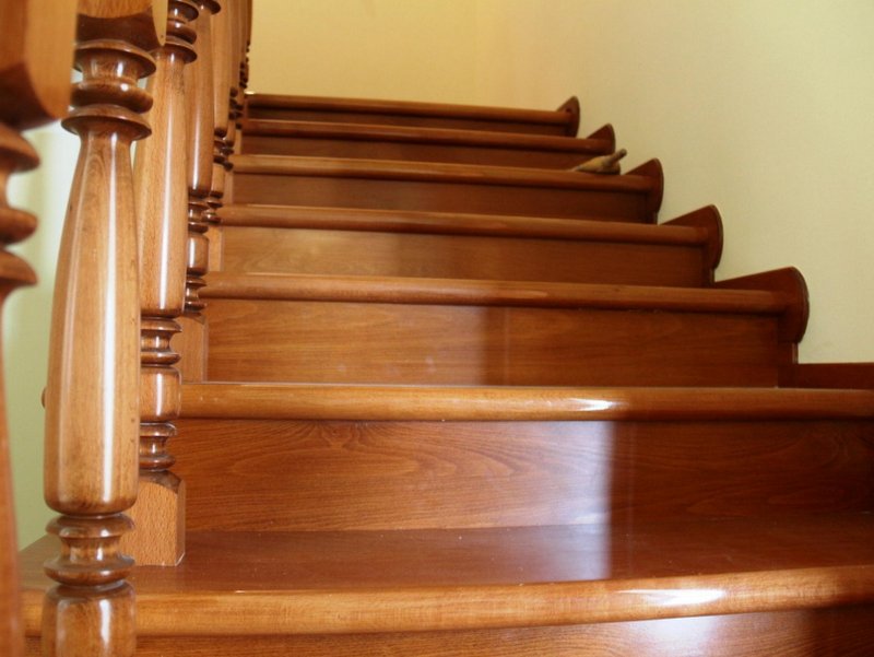 Classic wooden staircase with carved railings in a house for sale in Shushan, Montenegro.