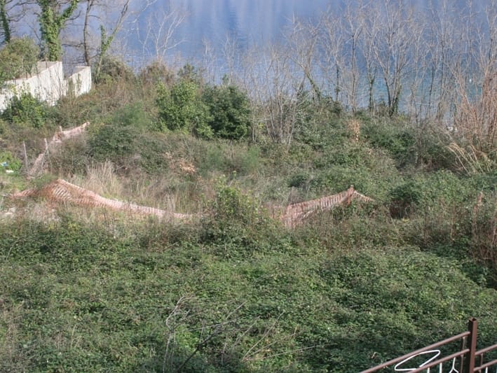 Building plot in Prčanj, Montenegro, with panoramic views of the Bay of Kotor and lush greenery.