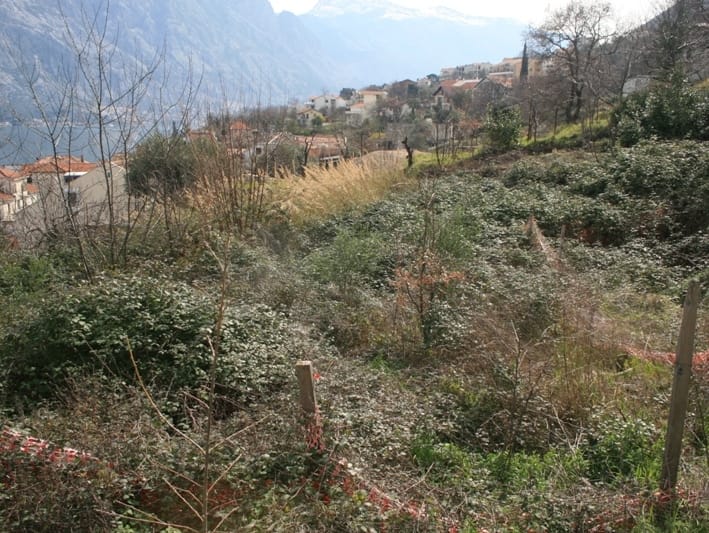 Land plot in Prčanj, Montenegro: mountain, sea, and village views, building plot with natural landscape.