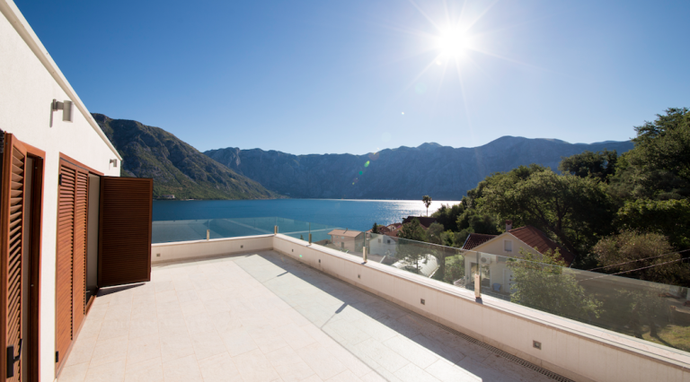 Spacious terrace with panoramic views of the sea and mountains in a house, Stoliv, Bay of Kotor, Montenegro.