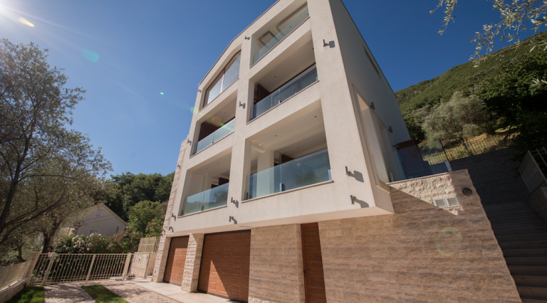 Modern three-story villa with terraces in Stoliv, Bay of Kotor, Montenegro: front view and garage.