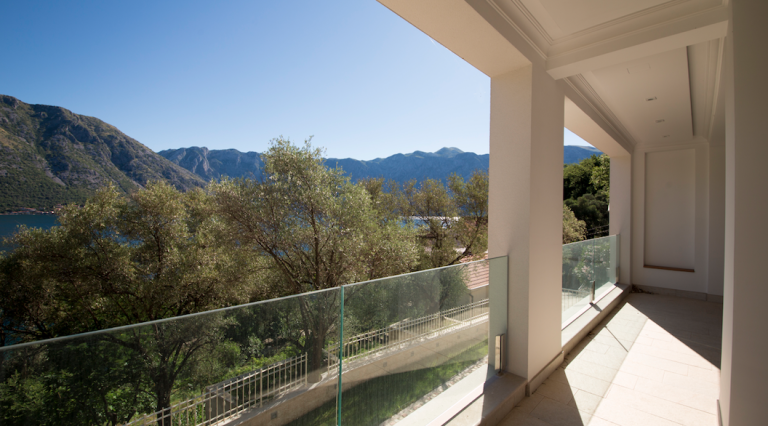 Spacious balcony with panoramic views of the Bay of Kotor and mountains, modern villa in Stoliv, Montenegro.