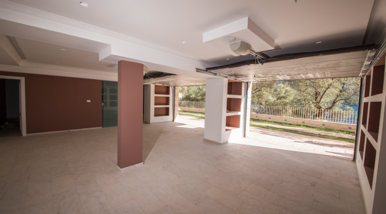 Spacious garage with a stone floor and built-in niches in a house in Stoliv, Bay of Kotor, Montenegro.