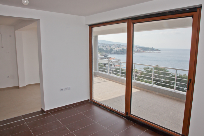 Bright living room with panoramic sea view and terrace in an apartment, Dobri Vody, Montenegro.