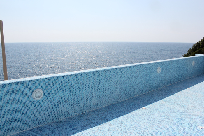 Pool with blue mosaic finish and panoramic sea view in the apartment, Dobri Vody, Montenegro.