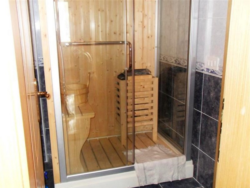 Bathroom with a wooden sauna and shower cabin in a house, Shushan, Montenegro.
