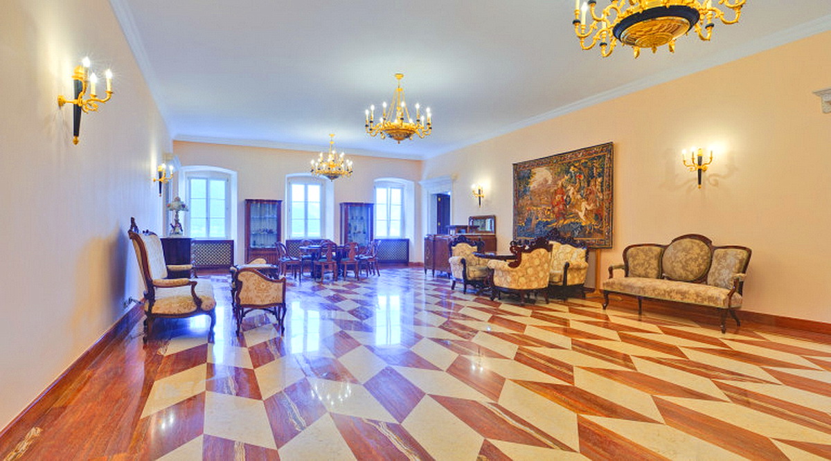 Luxurious living room with marble flooring and antique furniture in a villa in Dobrota, Montenegro. Classic interior.