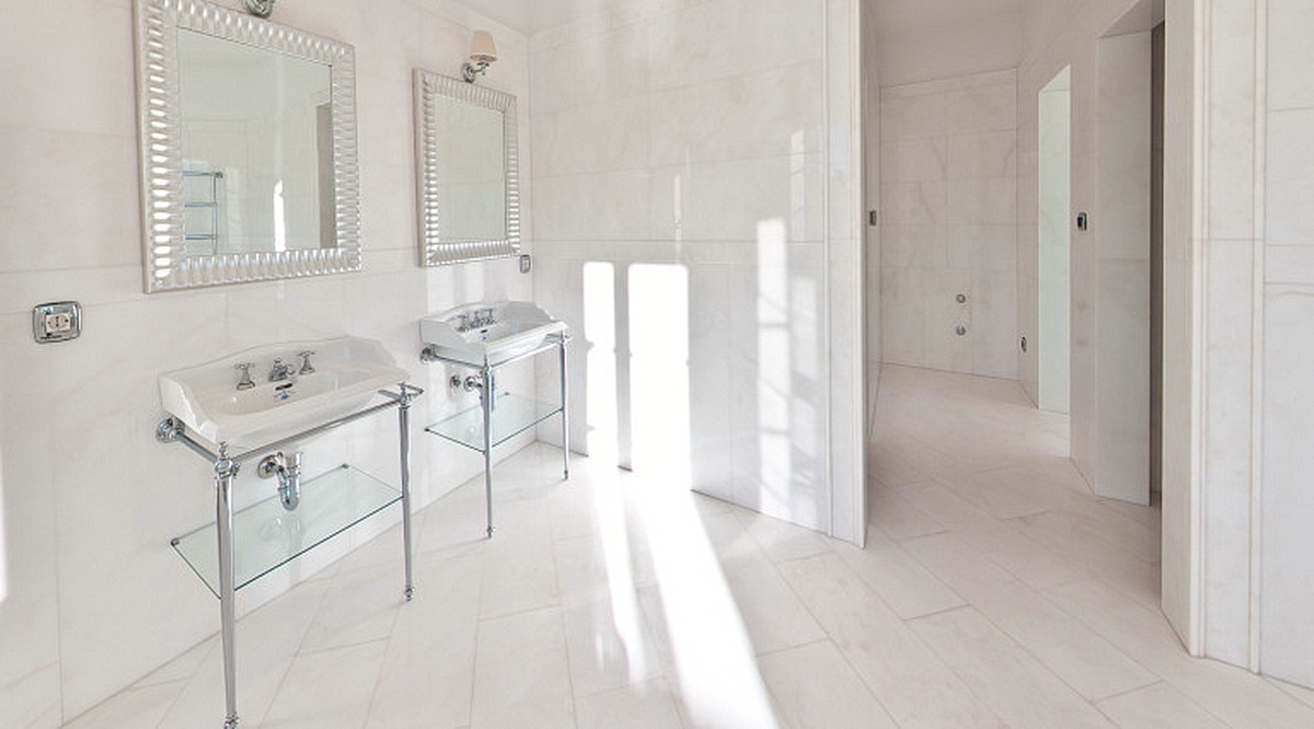 Bright bathroom with two sinks and marble finishes in a villa in Dobrota, Montenegro.