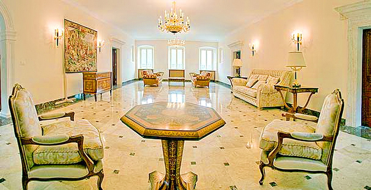 Luxurious classic-style living room in a villa in Dobrota, Montenegro: marble floor, antique furniture, and chandeliers.