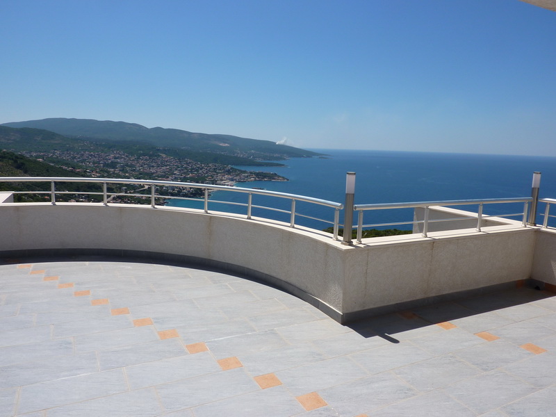 Spacious terrace with panoramic views of the sea and mountains, villa in Dobra Voda, Montenegro, tiled floor.